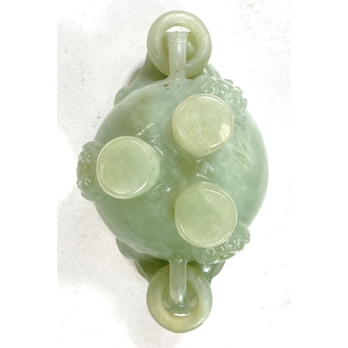 497A - A Chinese jade coloured hardstone censor with hoop handles, mythical beast carved finial and side mo... 