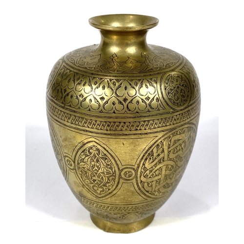 497B - An Islamic brass vase with etched decoration to the outside, tapering and flaring rim, ht. 14.5cm