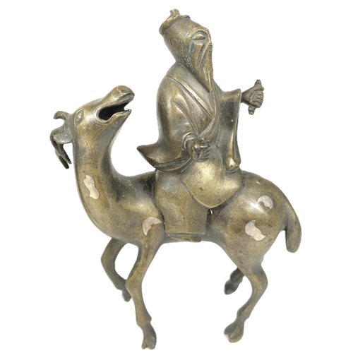 497C - A pair of Chinese brass censors in the form of men riding deer (some loss) ht. 17cm