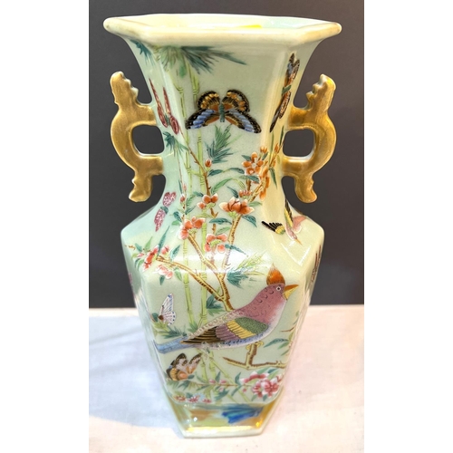 505A - A Chinese hexagonal celadon glazed vase with polychrome decoration of birds etc height 22cm