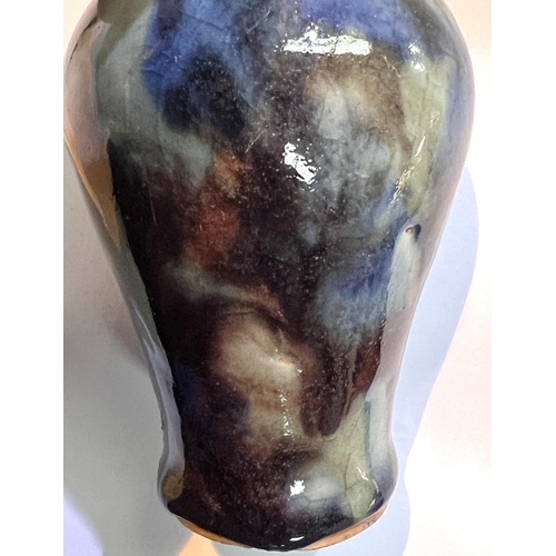 507A - A Chinese mottled glazed mei-ping vases with blues and greys, height 14cm on stand