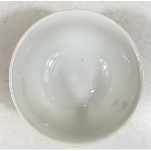 510C - A Chinese yellow ground bowl with polychrome decoration, Chinese characters, seal mark to base