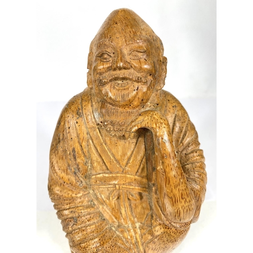 511A - A Chinese carved bamboo figure of a wise man (some damage) ht. 27cm