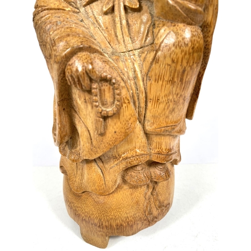 511A - A Chinese carved bamboo figure of a wise man (some damage) ht. 27cm