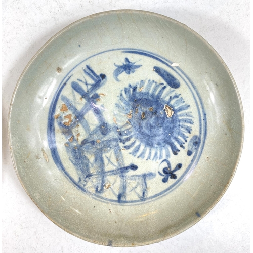 513A - Four Chinese dishes, Ming and Qing period, two plain glazed, one blue and white and one dark blue, l... 