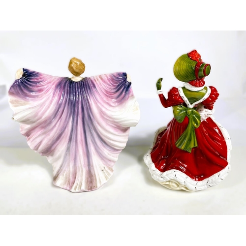 550 - Two Royal Doulton figures:  Christmas Day 2005 & Isadora