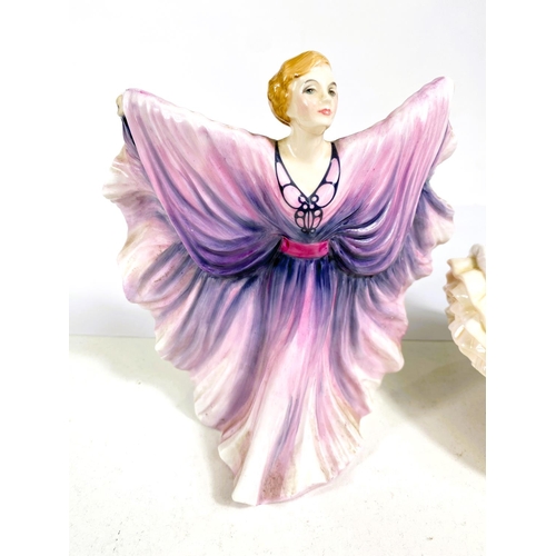 550 - Two Royal Doulton figures:  Christmas Day 2005 & Isadora