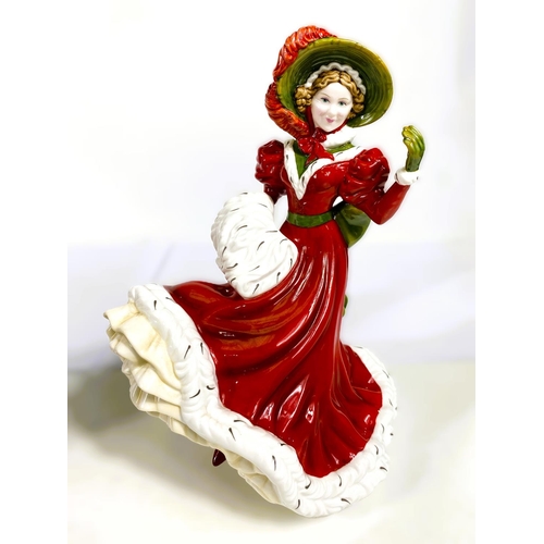 550 - Two Royal Doulton figures:  Christmas Day 2005 & Isadora