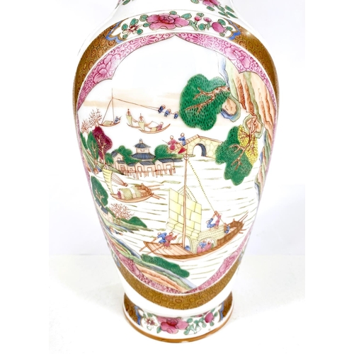 558 - A Chinese famille rose vase decorated with oval panels of boats, gilt and floral decoration, six cha... 