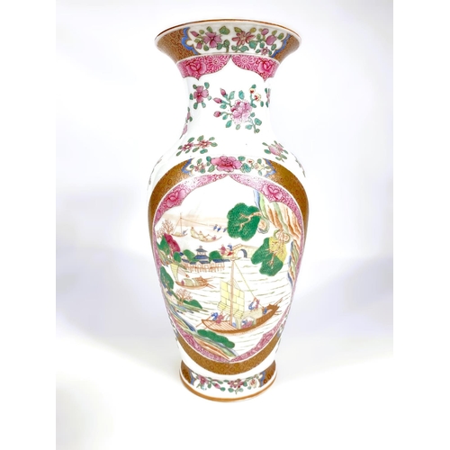 558 - A Chinese famille rose vase decorated with oval panels of boats, gilt and floral decoration, six cha... 