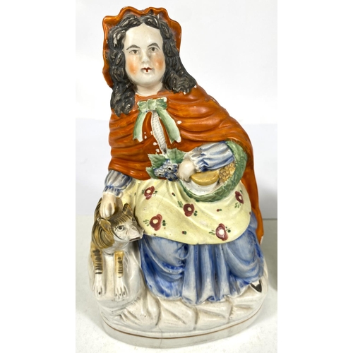 560 - A 19th century Staffordshire figure:  Little Red Riding Hood, eight 26cm (a.f.); a 19th ce... 