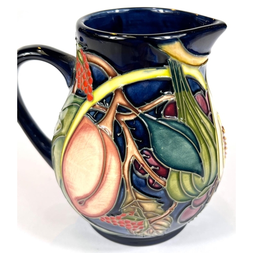 571C - Moorcroft: A Moorcroft 'Queens Choice' jug monogrammed beneath, ht. 12cm