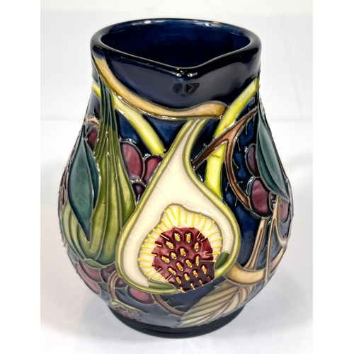 571C - Moorcroft: A Moorcroft 'Queens Choice' jug monogrammed beneath, ht. 12cm