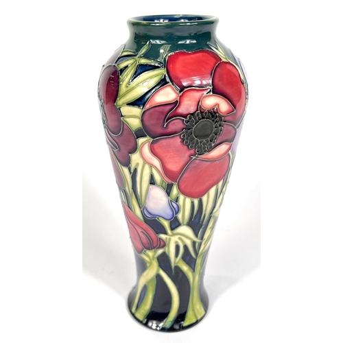 571E - Moorcroft: A pair of Moorcroft anemone vases, graduating blue to green ground, ht. 20cm