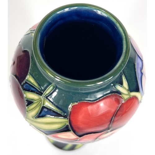 571E - Moorcroft: A pair of Moorcroft anemone vases, graduating blue to green ground, ht. 20cm