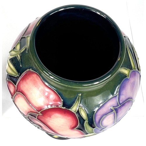 571E - Moorcroft: A pair of Moorcroft anemone vases, graduating blue to green ground, ht. 20cm