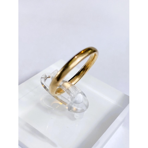 603 - A 9 carat gold wedding band, 1.9gm; an 18 carat gold pair of earring backs, 2.2gm; a 9 carat gold fi... 