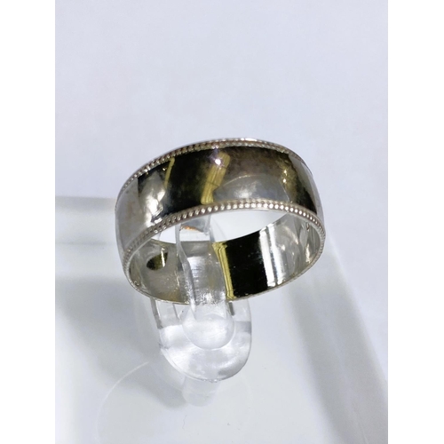 604 - A gent's 9 carat white gold ring; another 9 carat white gold ring, 8.2gm