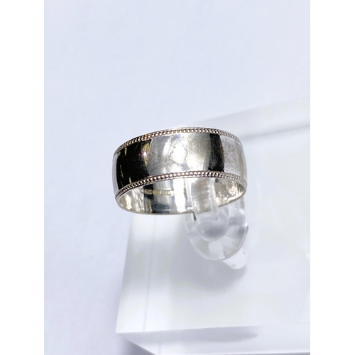 604 - A gent's 9 carat white gold ring; another 9 carat white gold ring, 8.2gm