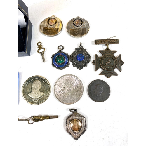 606 - Three sport medallions in silver enamel/gilt; other silver coins; badges; etc.