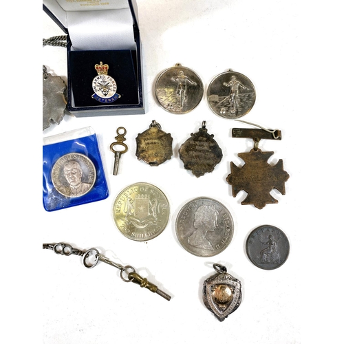 606 - Three sport medallions in silver enamel/gilt; other silver coins; badges; etc.