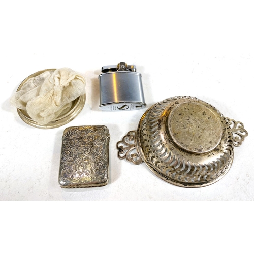 610 - A hallmarked silver vesta case, monogrammed; a silver rimmed strainer; a pierced silver bonbon dish,... 