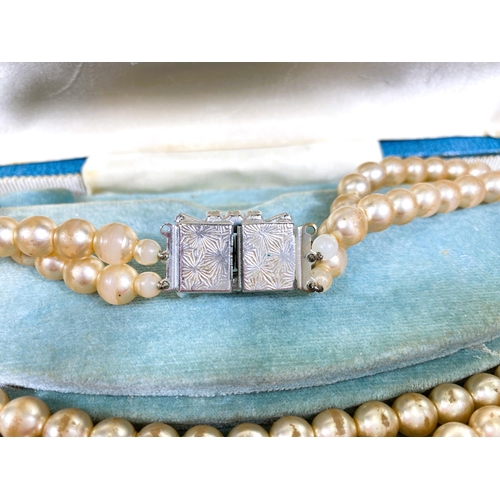 618 - A collection of Majorica pearl necklaces and bracelets, some with boxes, other simulated and other p... 