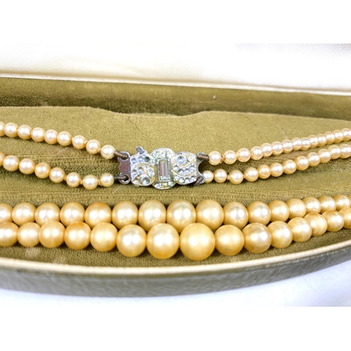 618 - A collection of Majorica pearl necklaces and bracelets, some with boxes, other simulated and other p... 