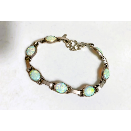 619 - A hallmarked silver and opal bracelet; a collection of earrings including Art Nouveau, amber, sapphi... 