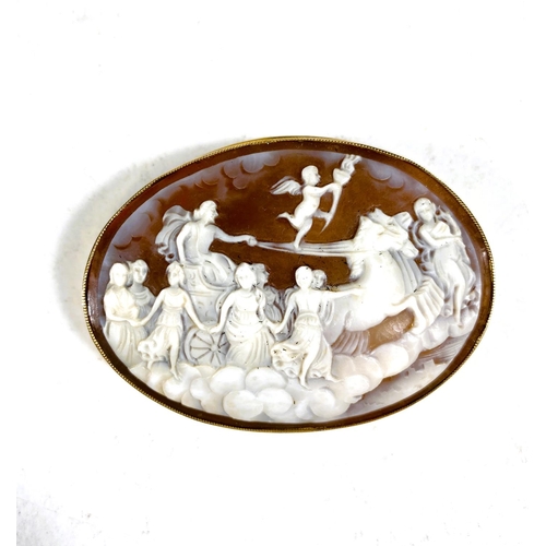 625 - A 9ct gold surrounded cameo brooch with classical Greek Gods scene, length 6cm, 19gm gross