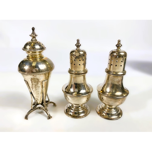 630 - A hallmarked silver pair of dome top pepper pots on pedestal bases, cased, marks worn. An Art Nouvea... 