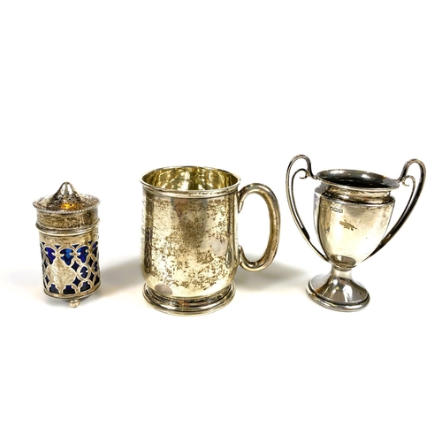 631 - Four hallmarked silver items:  a 2-handled trophy cup; a christening mug; a small trophy cup; a... 