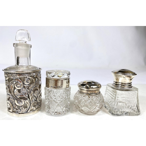 641 - A pair of cut glass slender scent bottles with hallmarked silver collars (1 stopper a.f.); a scent b... 