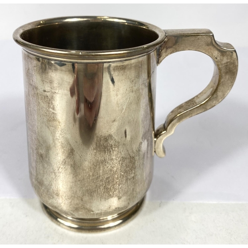 649 - A hallmarked silver 1 pint mug of tapering cylindrical form, on raised foot, Birmingham 1937, 5oz