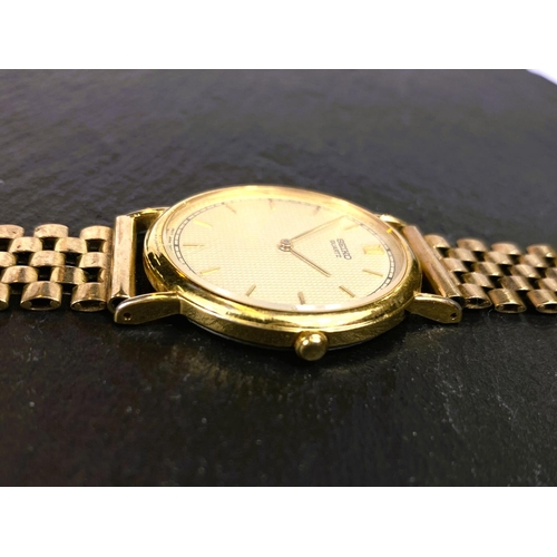 652 - A gent's Seiko gold plated wristwatch on 9 carat gate bracelet strap, 37.5gm gross weight