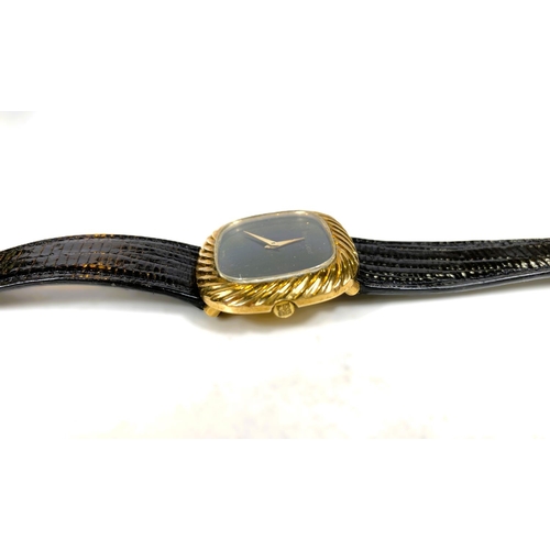 655 - A gent's yellow metal dress wristwatch by Beuche-Girod, stamped 375, with black dial and strap