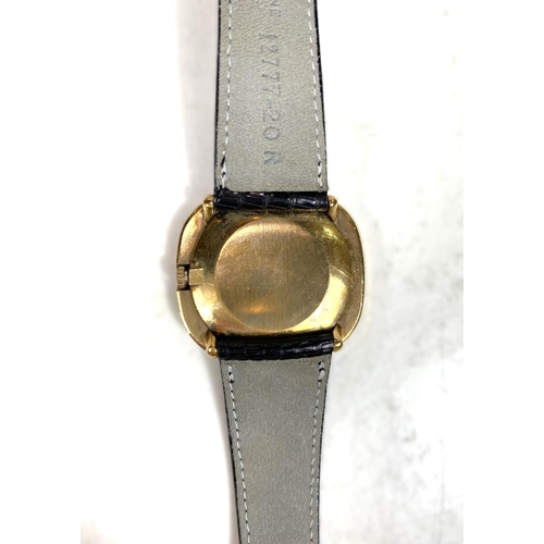 655 - A gent's yellow metal dress wristwatch by Beuche-Girod, stamped 375, with black dial and strap