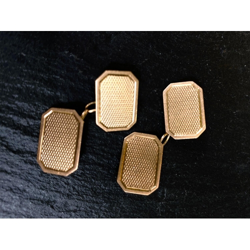 658 - A 9 carat hallmarked gold pair of cufflinks of canted rectangular form, 4.5gm