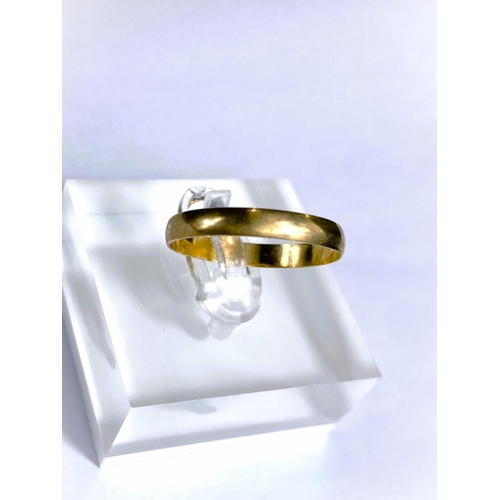 660 - A 9 carat hallmarked gold wedding ring, 1.2gm; a yellow metal eternity ring set clear stones, s... 