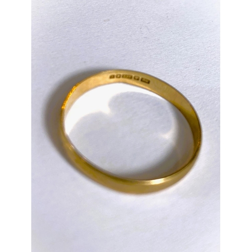 660 - A 9 carat hallmarked gold wedding ring, 1.2gm; a yellow metal eternity ring set clear stones, s... 