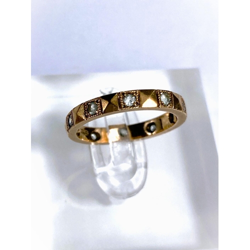 660 - A 9 carat hallmarked gold wedding ring, 1.2gm; a yellow metal eternity ring set clear stones, s... 