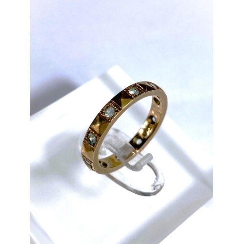 660 - A 9 carat hallmarked gold wedding ring, 1.2gm; a yellow metal eternity ring set clear stones, s... 