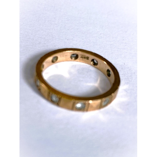 660 - A 9 carat hallmarked gold wedding ring, 1.2gm; a yellow metal eternity ring set clear stones, s... 