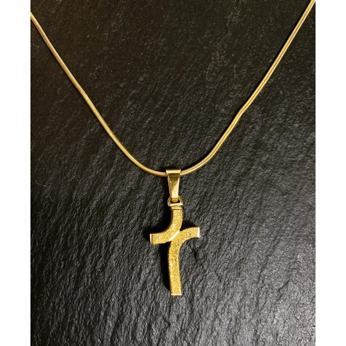 663 - A modernist cross pendant, stamped 750, on reticulated rattail chain, stamped 750, 10gm