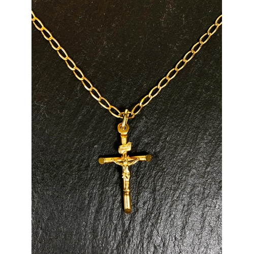 666 - A yellow metal crucifix pendant, stamped 375, on 9 carat hallmarked gold chain, 4.4gm