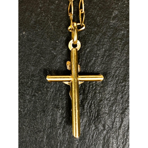 666 - A yellow metal crucifix pendant, stamped 375, on 9 carat hallmarked gold chain, 4.4gm