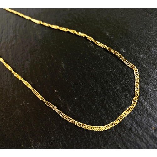 670 - A yellow metal chain of twisted curb links, stamped '375', 4.8gm