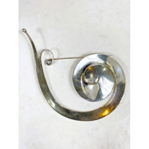 673 - Georg Jensen:  a large 'Pram' brooch designed by Vivianna Torun Bülow, stamped Georg ... 