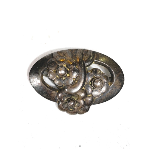 677 - Georg Jensen:  a silver pierced oval brooch with 3 flowers, stamped Georg Jensen Sterling ... 