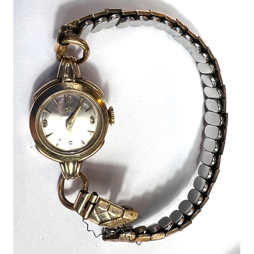 705 - A lady's Omega wrist watch, another Omega De Ville lady's wrist watch and a Raymond Weil watch in an... 